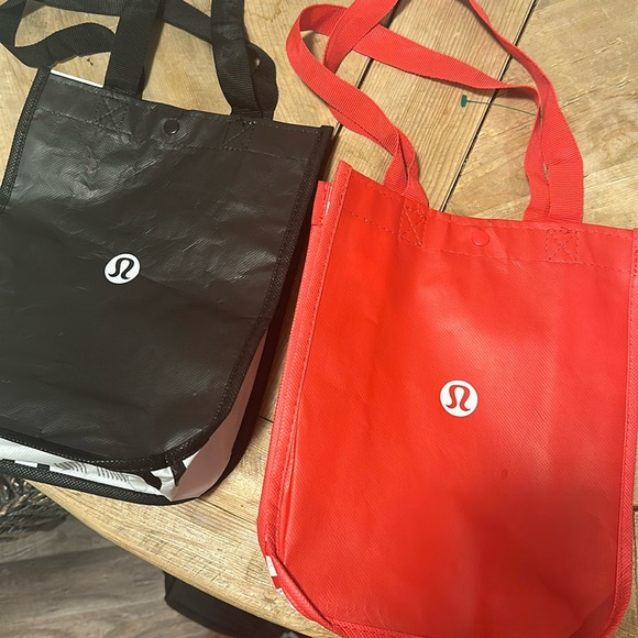 Red and black Lululemon bags with snaps - Picture 1 of 1